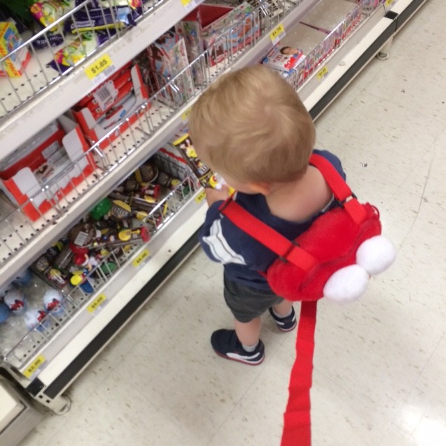 toddler wearing elmo harness